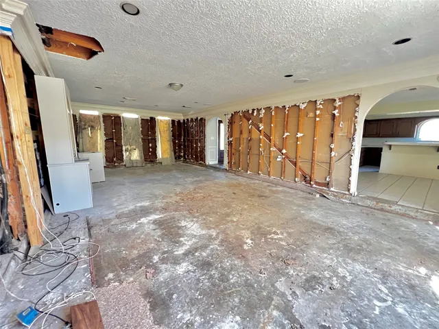 a view of a livingroom with an empty space and a window