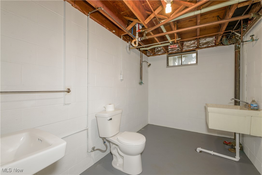 4761 Waterloo Road Atwater, OH 44201 - Photo 25 of 45 Full bathroom in the basement with concrete flooring, sink, shower and toilet