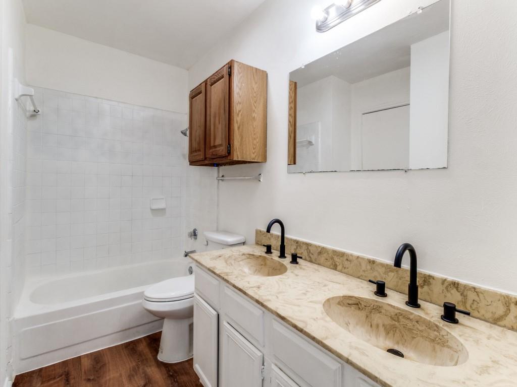 2321 Colonial Mesquite, TX 75150 - Photo 20 of 25 a bathroom with a sink toilet and shower