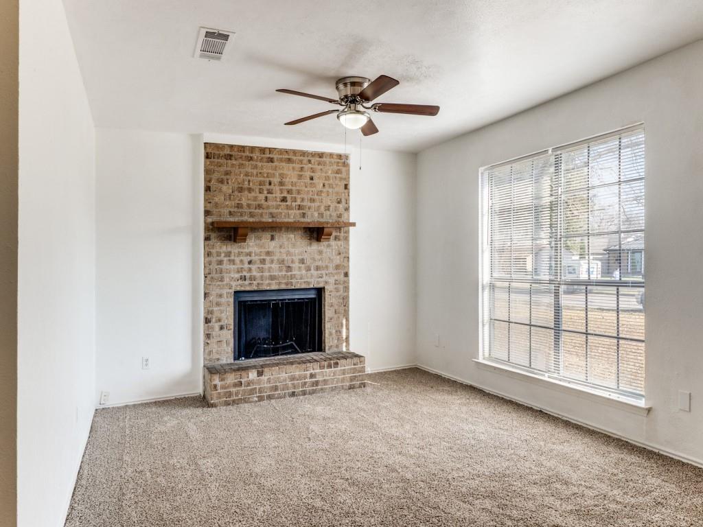 2321 Colonial Mesquite, TX 75150 - Photo 5 of 25 a view of an empty room with a fireplace and a window