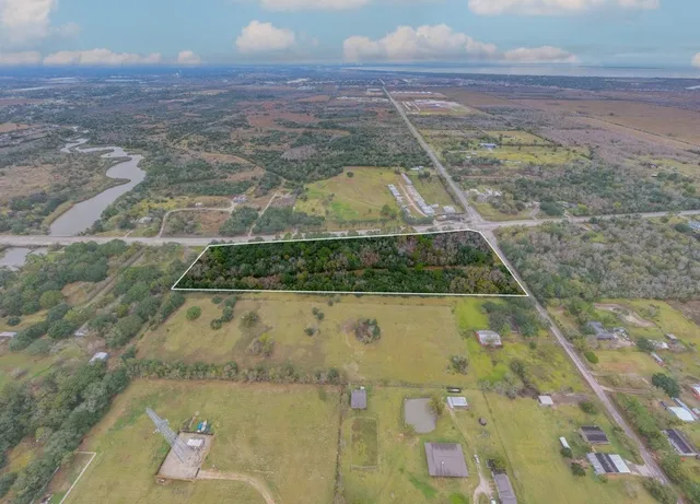 a view of bathtub with wooden floor