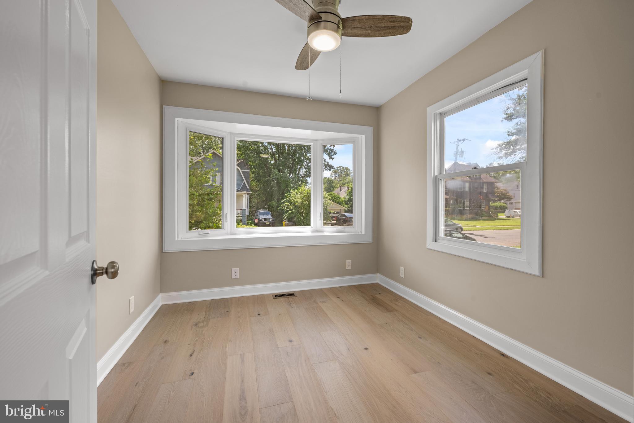 15 Lafayette Road Audubon, NJ 08106 - Photo 22 of 50 a view of an empty room with a window and wooden floor