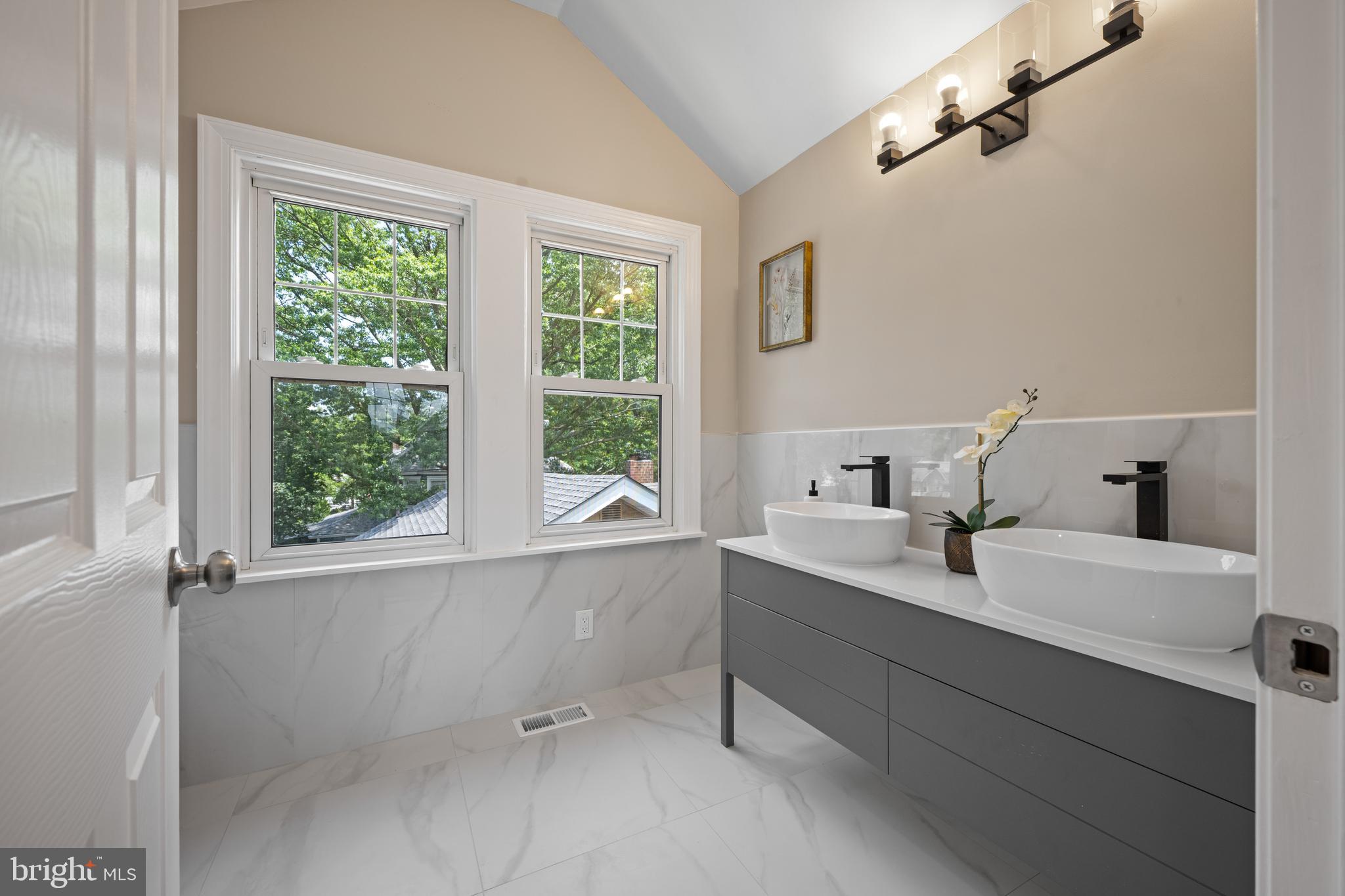 15 Lafayette Road Audubon, NJ 08106 - Photo 46 of 50 a bathroom with a double vanity sink window and a mirror