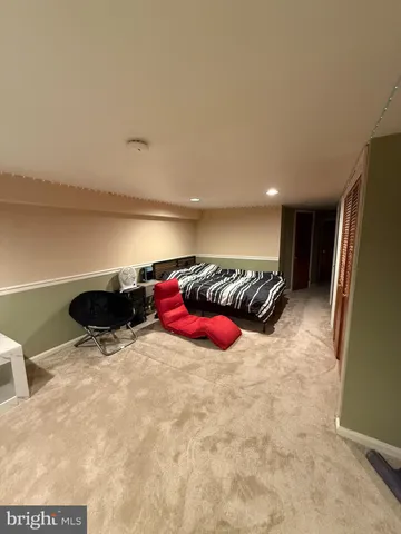 a view of a room with a bed and toys