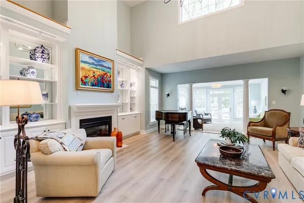 a living room with furniture fireplace and window