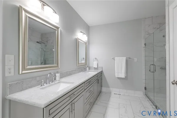 a spacious bathroom with shower bathtub and window