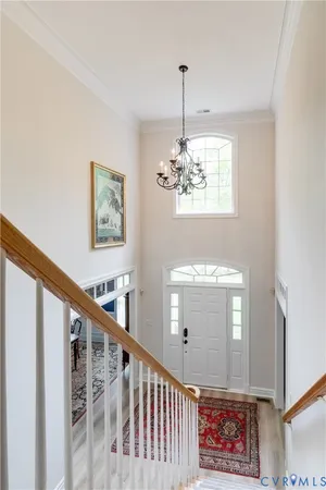 an entryway with wooden floor