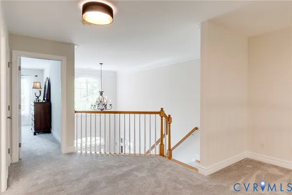 a bedroom with a bed and a lamp on table