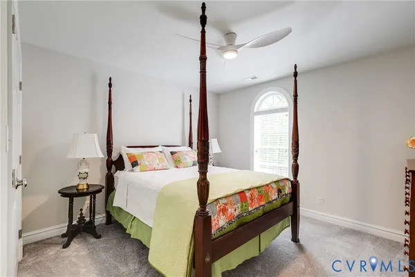 a bedroom with two beds and window