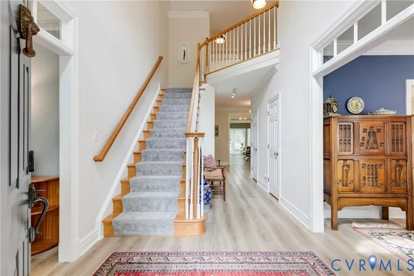 a view of entryway and hall with dining room