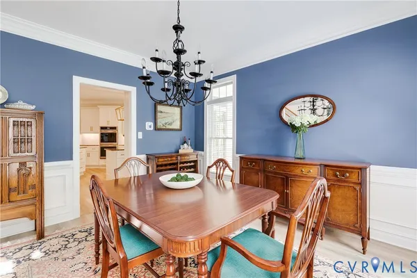 a kitchen with stainless steel appliances granite countertop a sink a stove and cabinets