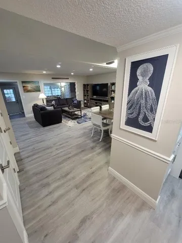 a view of a living room and a refrigerator