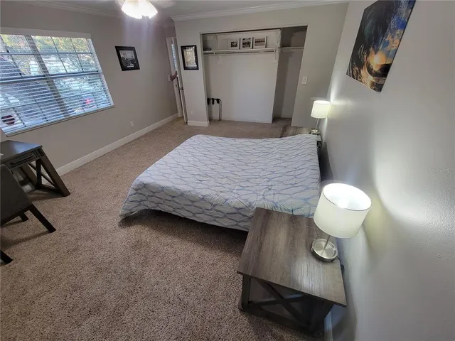 a bathroom with a granite countertop sink a toilet and a mirror