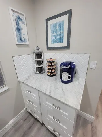 a kitchen with stainless steel appliances a sink a stove a refrigerator and cabinets