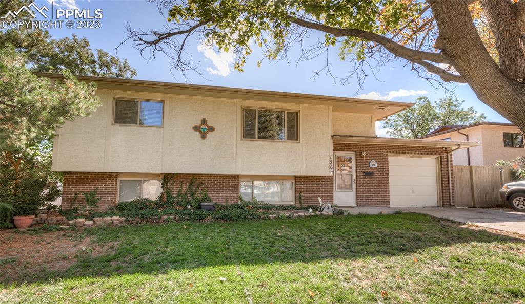 126 La Rochelle Drive Pueblo, CO 81005 - Photo 1 of 42 a view of a house with a yard