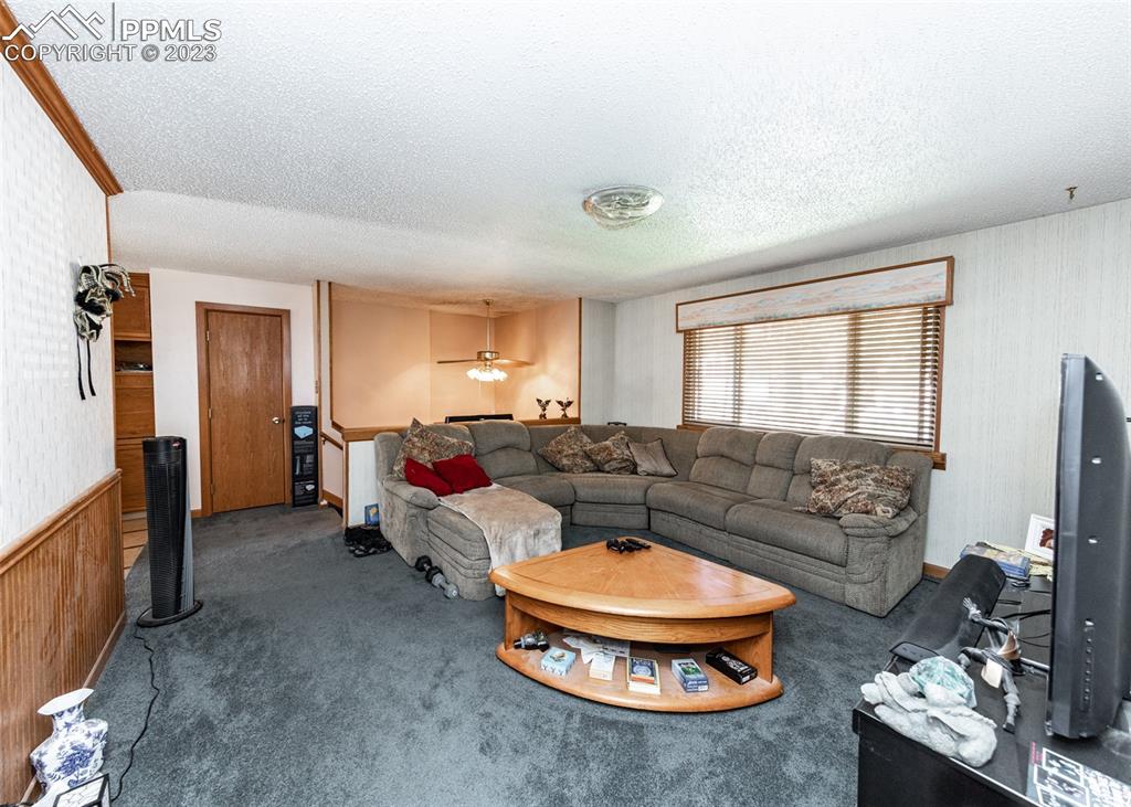 126 La Rochelle Drive Pueblo, CO 81005 - Photo 13 of 42 a living room with furniture and a window