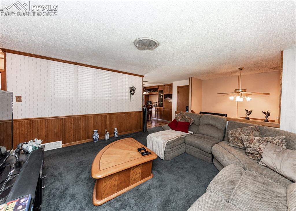 126 La Rochelle Drive Pueblo, CO 81005 - Photo 14 of 42 a living room with furniture and a table