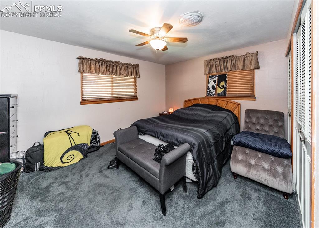 126 La Rochelle Drive Pueblo, CO 81005 - Photo 16 of 42 a bedroom with a bed and a window
