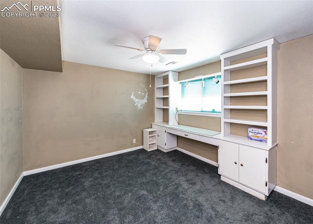 126 La Rochelle Drive Pueblo, CO 81005 - Photo 26 of 42 a room with a fan and a window