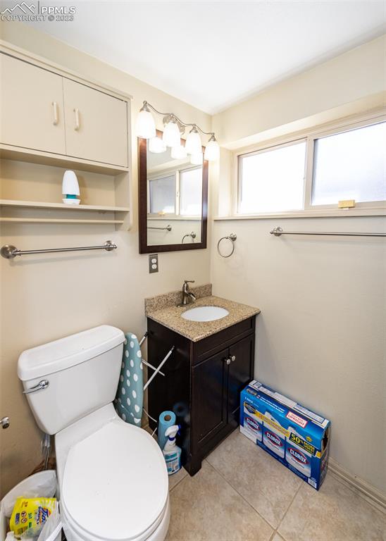 126 La Rochelle Drive Pueblo, CO 81005 - Photo 28 of 42 a bathroom with a toilet sink and mirror