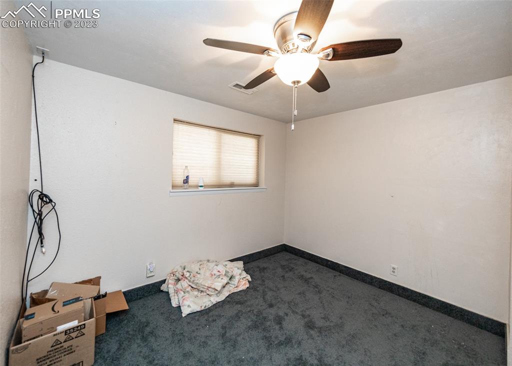 126 La Rochelle Drive Pueblo, CO 81005 - Photo 30 of 42 a room with chandelier fan and windows