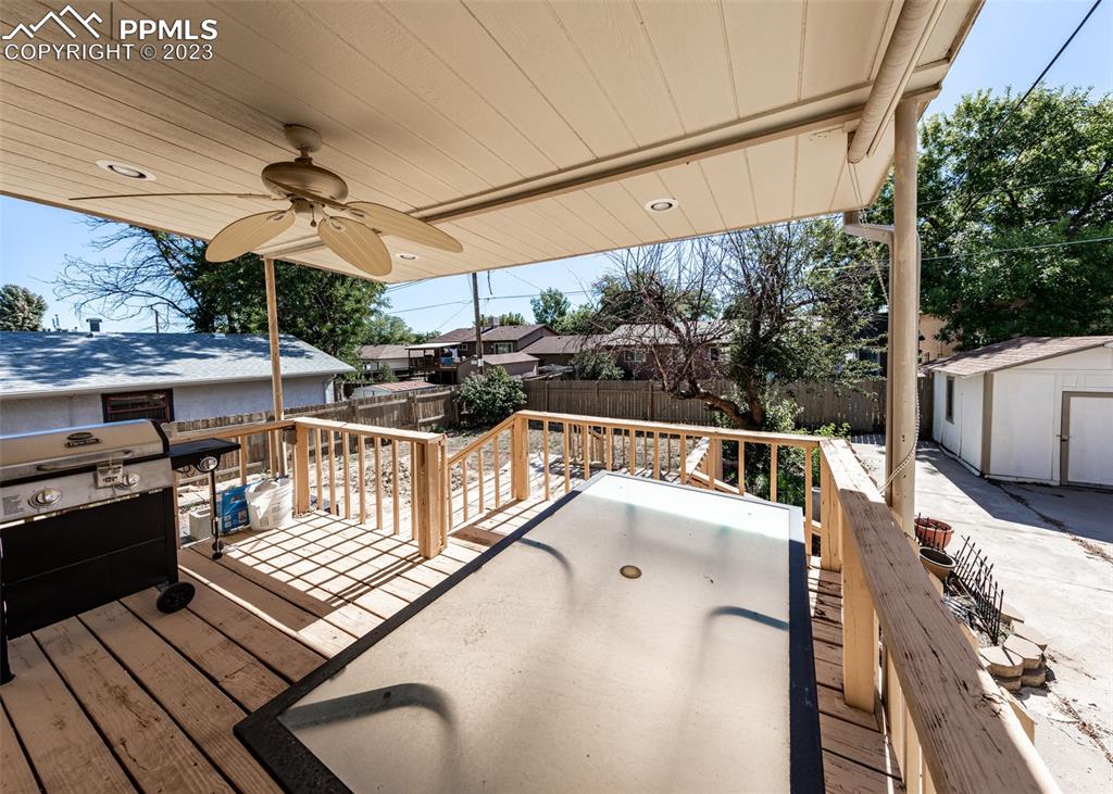 126 La Rochelle Drive Pueblo, CO 81005 - Photo 36 of 42 a view of a patio with a table and chairs
