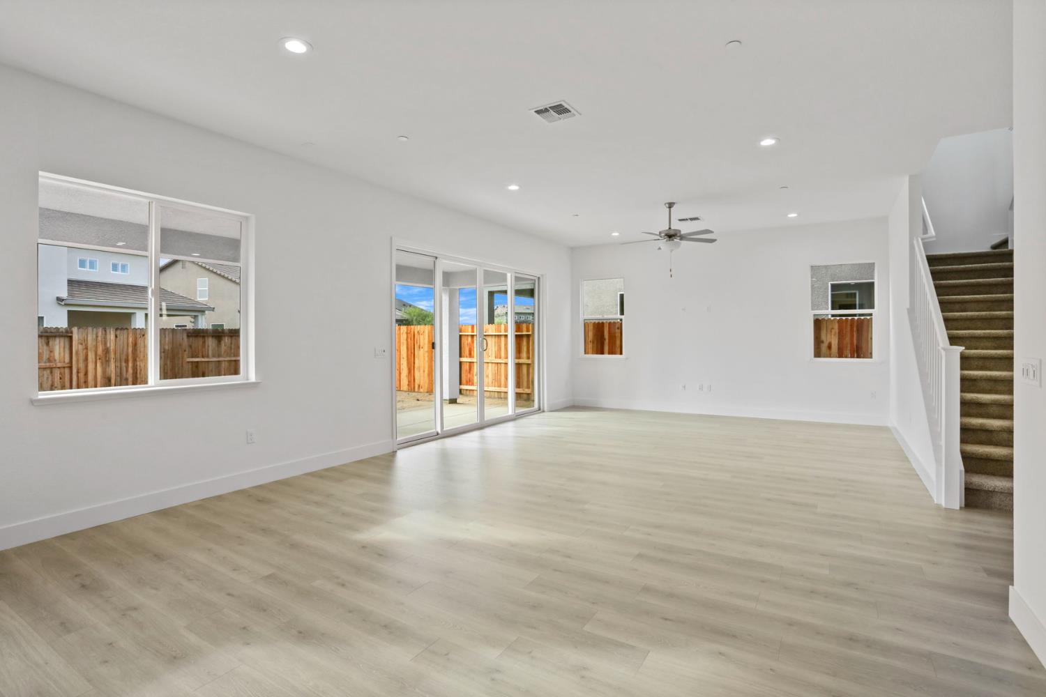 2291 Paramount Lane Manteca, CA 95337 - Photo 19 of 34 a view of an empty room with wooden floor and a window
