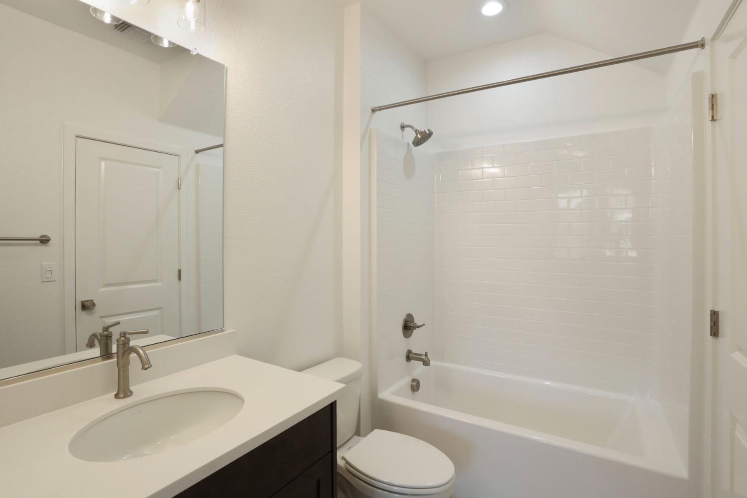2291 Paramount Lane Manteca, CA 95337 - Photo 22 of 32 a bathroom with a sink toilet and shower