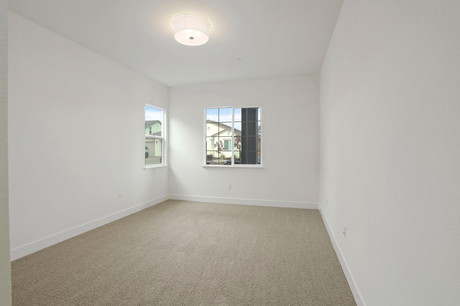 2291 Paramount Lane Manteca, CA 95337 - Photo 22 of 34 an empty room with windows