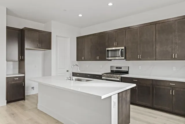 a kitchen with a sink and a microwave