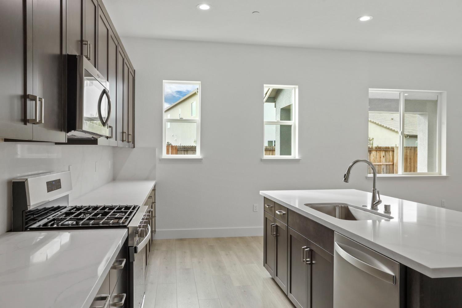 2291 Paramount Lane Manteca, CA 95337 - Photo 10 of 32 a kitchen that has a sink and a stove