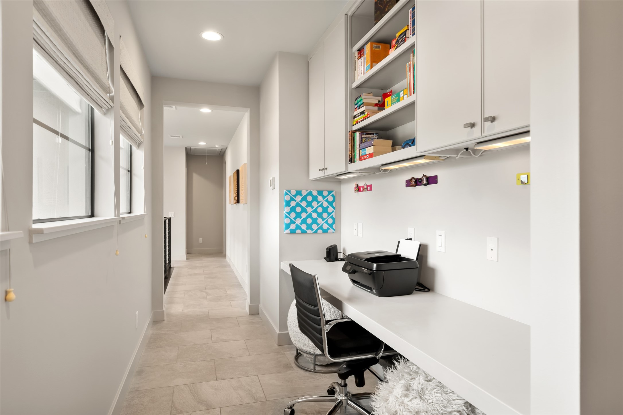 24902 Delaney Knoll Spring, TX 77389 - Photo 26 of 49 a room that has a chair and a white cabinets