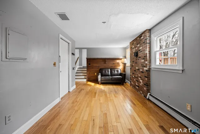 a view of livingroom with furniture and fireplace