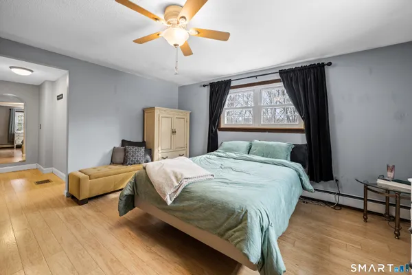 a bedroom with bed and window