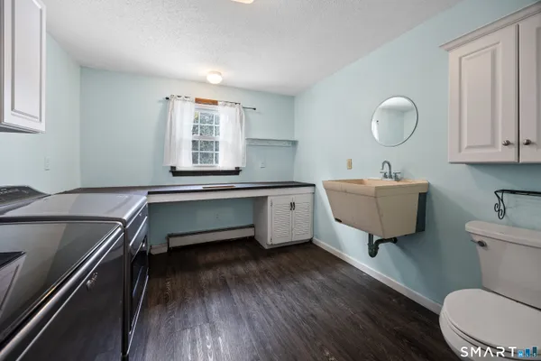 a room with furniture and wooden floor
