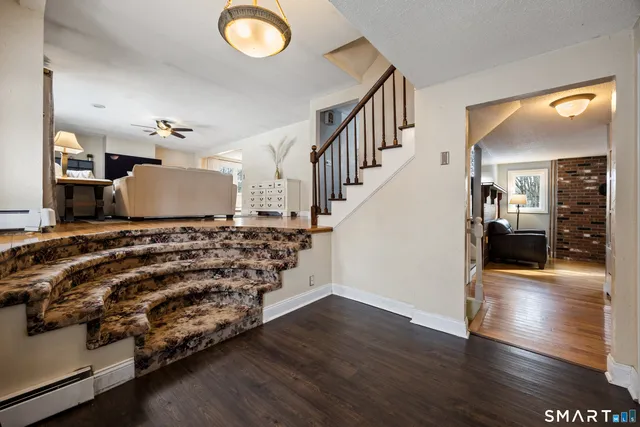 a view of a livingroom with wooden floor