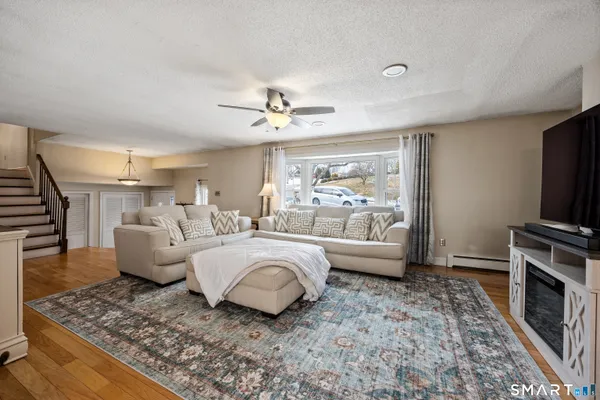 a living room with furniture and a flat screen tv
