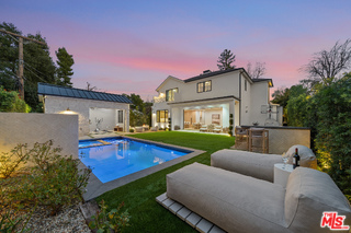 a view of a house with a back yard