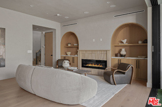 11317 Valley Spring Lane Studio City, CA 91602 - Photo 12 of 44 a living room with furniture and a fireplace
