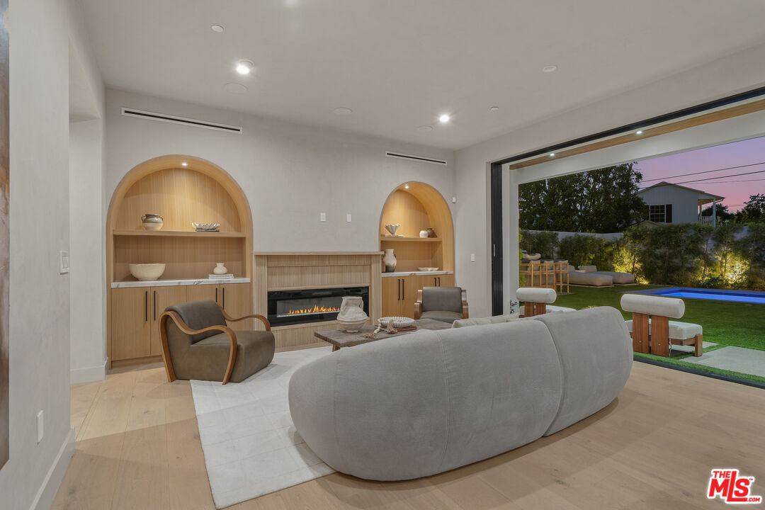 11317 Valley Spring Lane Studio City, CA 91602 - Photo 13 of 44 a living room with furniture and a large window