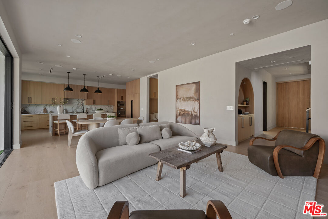 11317 Valley Spring Lane Studio City, CA 91602 - Photo 14 of 44 a living room with furniture and a large window