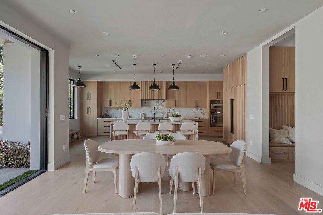 11317 Valley Spring Lane Studio City, CA 91602 - Photo 15 of 44 a view of a dining room with furniture