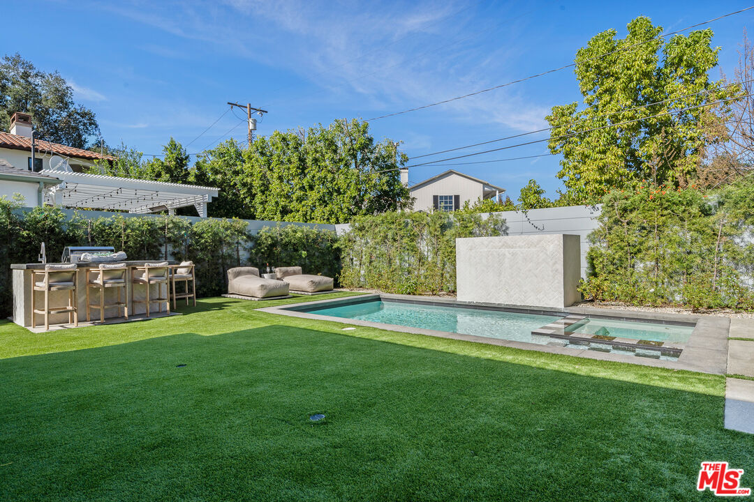11317 Valley Spring Lane Studio City, CA 91602 - Photo 21 of 44 a view of a house with a yard and sitting area