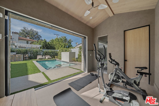 11317 Valley Spring Lane Studio City, CA 91602 - Photo 27 of 44 a view of a room with gym equipment
