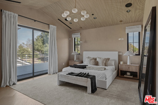 11317 Valley Spring Lane Studio City, CA 91602 - Photo 31 of 44 a living room with furniture and a chandelier