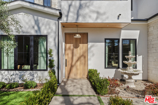 11317 Valley Spring Lane Studio City, CA 91602 - Photo 5 of 44 a front view of a house with a yard