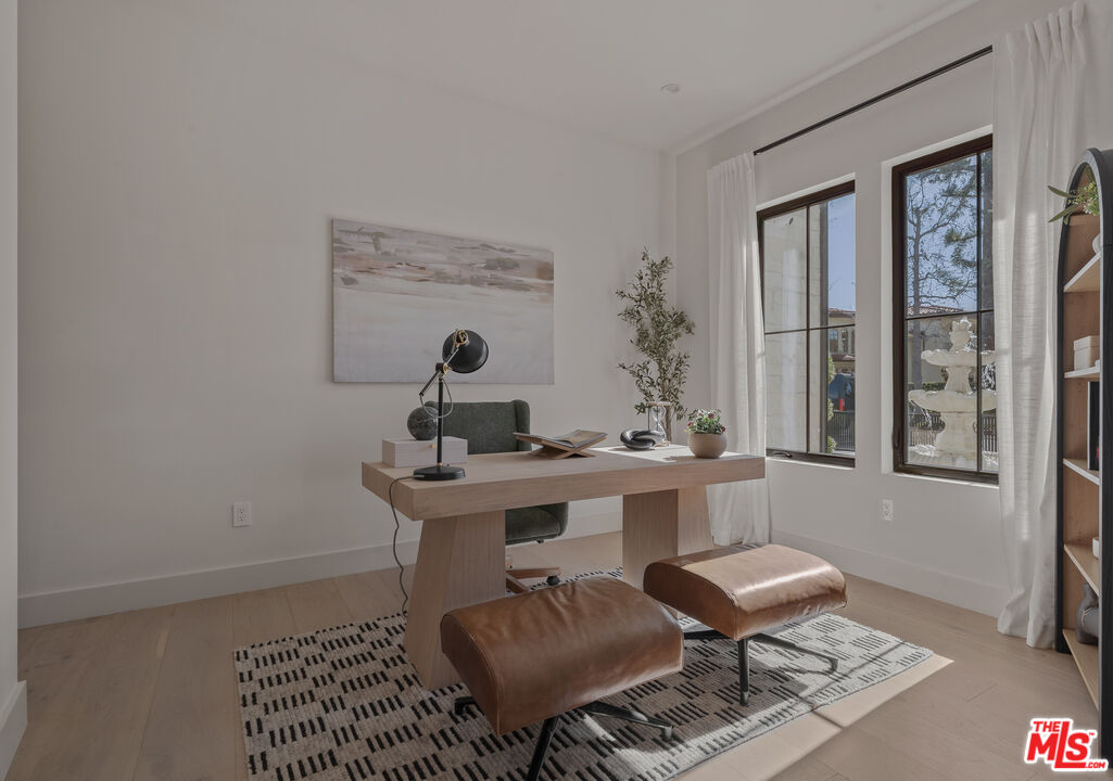 11317 Valley Spring Lane Studio City, CA 91602 - Photo 9 of 44 a view of a workspace with furniture