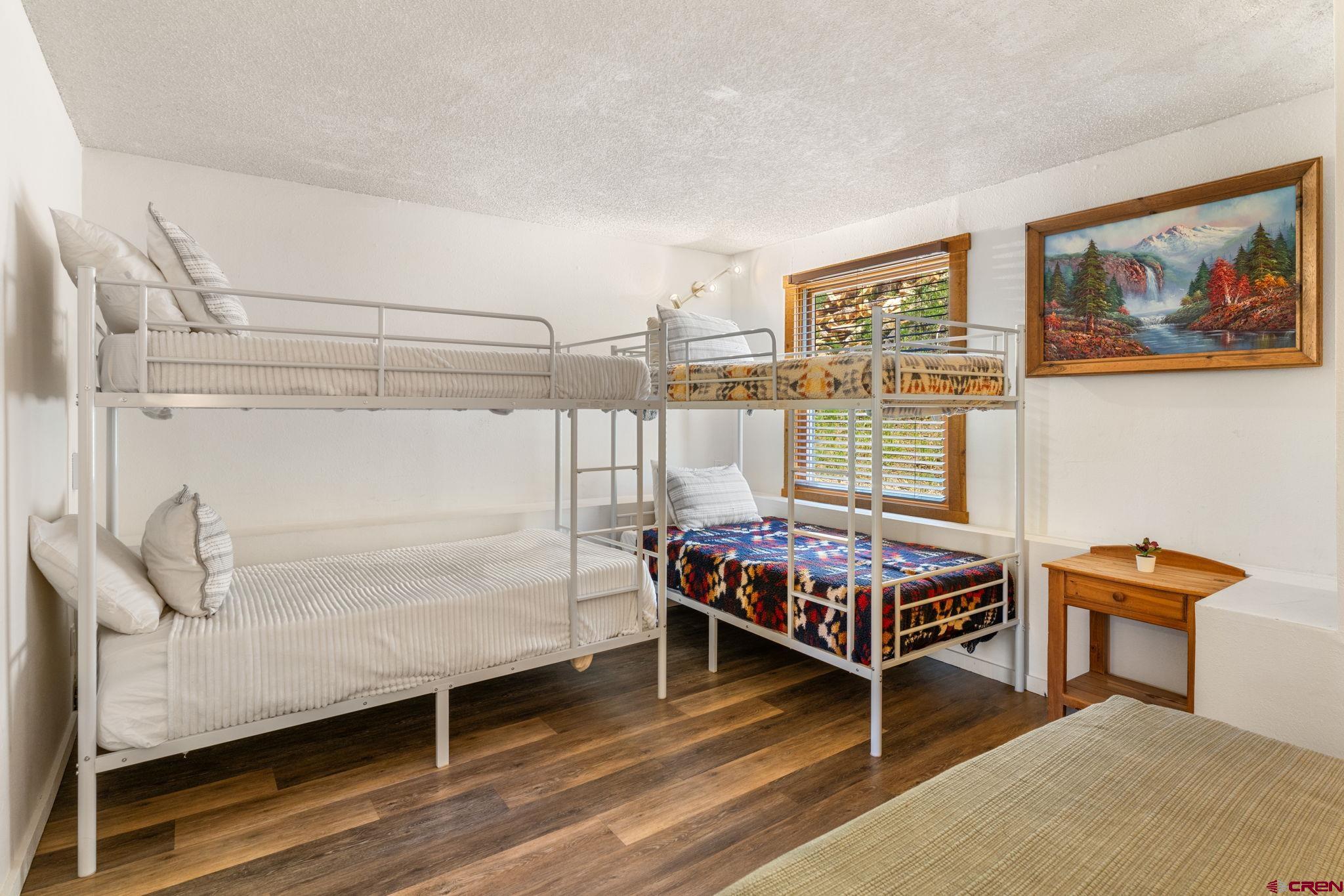 72 Hunter Hill Road, Unit I204 Crested Butte, CO 81225 - Photo 22 of 44 a bed room with furniture and a window