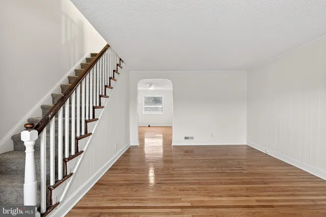 a view of an entryway with wooden floor