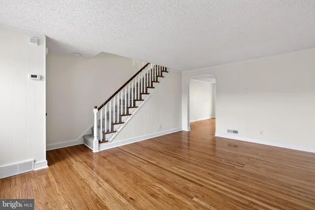 a view of an entryway with wooden floor